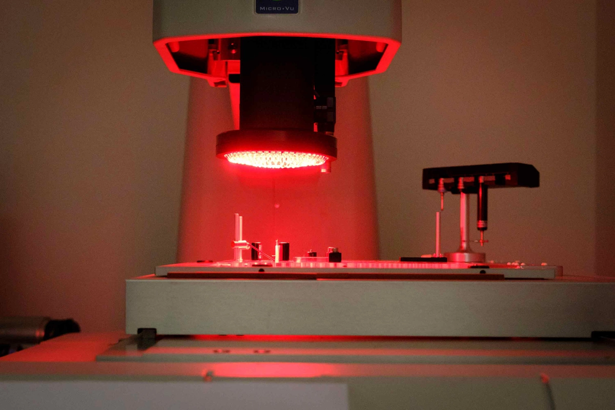 Laboratory machine with red light used for precision inspection
